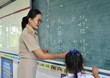 © Wararat - Thai female teacher are teaching mathematics to elementary school students in classroom, The message posted at the bottom of the chalkboard is an educational material that is vowels in Thai Language