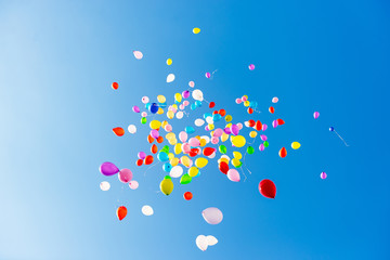 Wall Mural - Bright colorful balloons over blue sky background