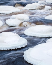 Close-up From River Rapids At Winter Time In Finland. With Beautiful Ice Shapes.
