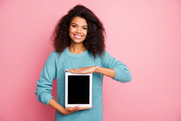 Sticker - Portrait of her she nice-looking attractive lovely charming cheerful cheery wavy-haired girl holding in hands demonstrating new cool device isolated over pink pastel color background