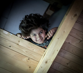 Wall Mural - Upside down boy in wooden cottage