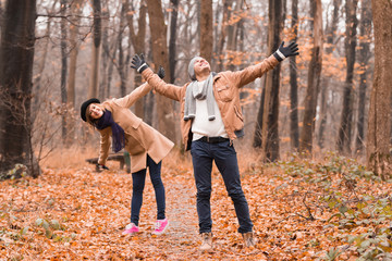 Couple in the park enjoying nice autumn / winter time.