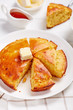 © myviewpoint - Cornbread on a white plate, top view