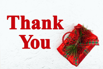 Wall Mural - Thank You message with red Christmas present with pine cones
