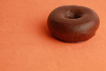 Poster - chocolate bagel on colorful background