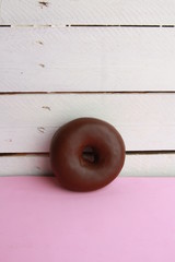 Poster - chocolate bagel on colorful background