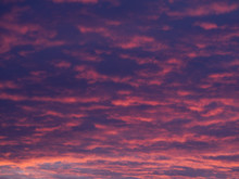 Pink And Purple Clouds At Sunset Fill The Frame