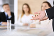 © Iryna - Business presentation. Businessman giving speech to colleagues and partners at corporate meeting or conference, close-up of speaker hands