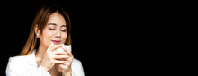 Woman Holding A Cup Of Coffee Enjoying And Happy The Smell Of Her Hot Coffee In The Morning With Copy Space For Banner.