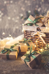 Wall Mural - christmas and zero waste, eco friendly packaging gifts in kraft paper on a wooden table, eco christm