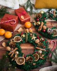 Christmas wreaths on wooden background.