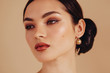 © Liliya Rodnikova/Stocksy - Beauty portrait of attractive brunette woman with classy make up