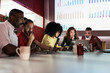 © Santi Nunez/Stocksy - Business group at a workshop in the office