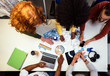 © Santi Nunez/Stocksy - Unrecognizable business group at a workshop in the office