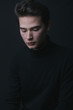 © Alberto Bogo/Stocksy - Young man in black clothes