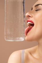 Woman Model Licking Glass Bottle