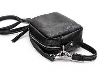 Luxury fashion women leather black handbag isolated on a white background.