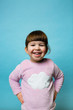 © Giorgio Magini/Stocksy - Studio Portrait of a Happy Toddler Girl with Pink Pajamas