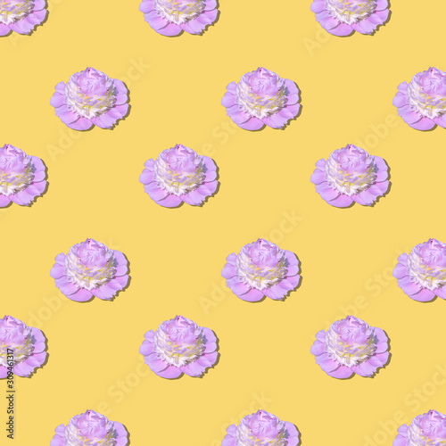 Pattern pink peony flower with a yellow center on a yellow background