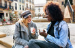 © Marco Govel/Stocksy - Two girl friends on the street