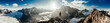 © Chris Zielecki/Stocksy - Panoramic view of tourist on mountain peak