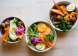 © Nadine Greeff/Stocksy - Grain bowls topped with healthy ingredients