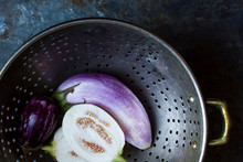 Rinsed Eggplants In Colander