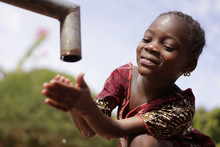 Close Up Of African Black Ethnicity Girl Beautiful Drinking Water For Health