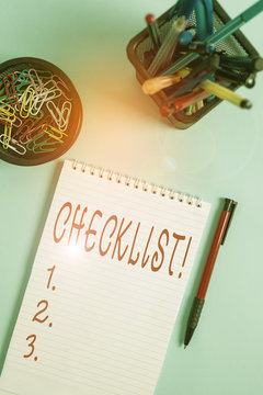 Handwriting text writing Checklist. Conceptual photo list items required things be done or points considered Notebook and writing equipment with computer mouse above pastel backdrop