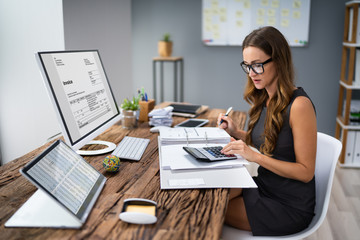 Wall Mural - Accountant Calculating Tax At Desk