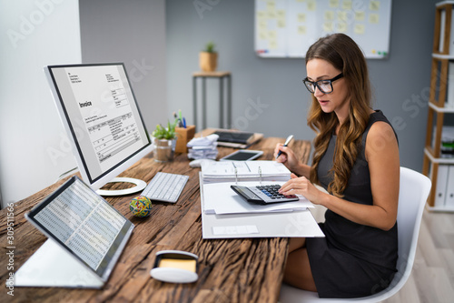Fotomural Accountant Calculating Tax At Desk