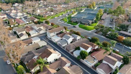 Wall Mural - Aerial view of middle class suburban neighborhood with houses next to each other in Irvine, California, USA. Aerial view of residential area.