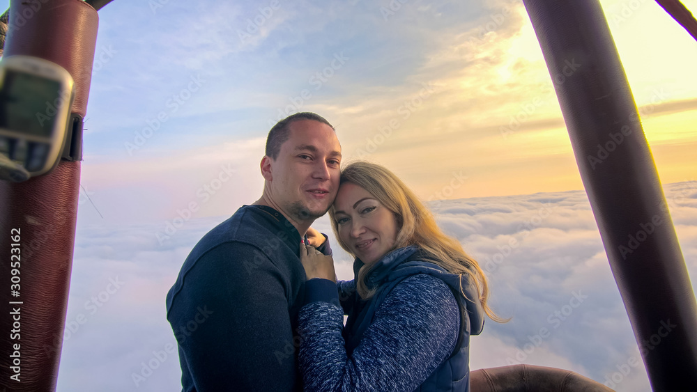 Adventure love couple on hot air balloon watermelon. Man and woman kiss ...