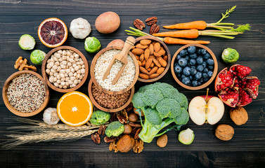 Wall Mural - Ingredients for the healthy foods selection. The concept of healthy food set up on wooden background.