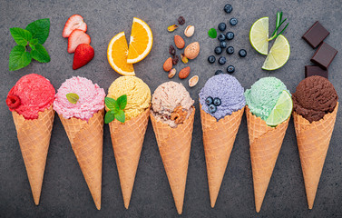 Fototapete - Flat lay ice cream cones collection on dark stone background . Blank crispy ice cream cone with copy space for sweets menu design.