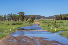 Flooded Dirt Road In The South Of Johannesburg South Africa After Heavy Seasonal Summer Rainfall Image In Horizontal Format With Copy Space