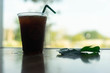 blur background with americano by the window