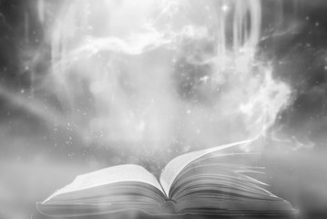 Poster - Imagine opening an old book blurred with magic power on the table and the English alphabet floating above the book with magic light as a beautiful background design.
