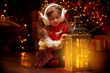 Wall Mural - little girl sits with lantern