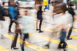 © hanohiki - blurry people crossing street on pedestrian crossing