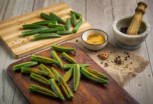 Fotomural Preparation of stuffed masala and kurkuri bhindi