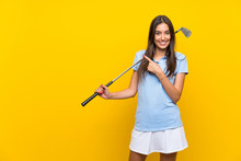 Young Golfer Woman Over Isolated Yellow Wall Pointing To The Side To Present A Product