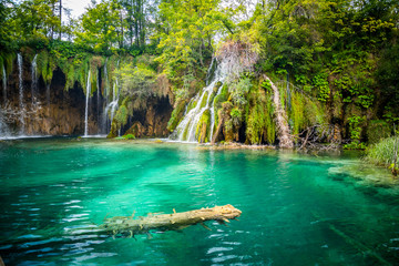 Amazing waterfalls with crystal clear water in the forest in Plitvice lakes National Park, Croatia. Nature landscape