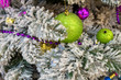 Christmas and New Year holiday decorations background. Detail of Christmas tree with festive balls and ornaments.