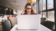© GalakticDreamer - Overworked woman 20 years old seriously watching video online using modern netbook sitting at cafeteria worried about project, stressed student feeling headache doing complicated homework via laptop