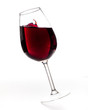 Glass of red splashing wine on white background