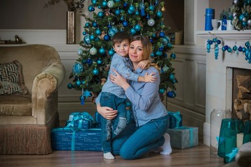 Wall Mural - Nice mom and little boy at Christmas time, children and parents lifestyle