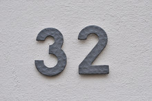 A House Number Plaque, Showing The Number Thirty Two (32)