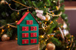 © Antipina - wooden advent calendar in the form of a house under the christmas tree surprise expectation countdown timer new year's eve play with children family evening leisure game creativity 1 week