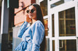 © GalakticDreamer - Portrait of young beautiful fashionable brunette girl with long hair wearing dark sunglasses, charming trendy women in stylish apparel looking at camera spensing time outdoors at sunny summer day